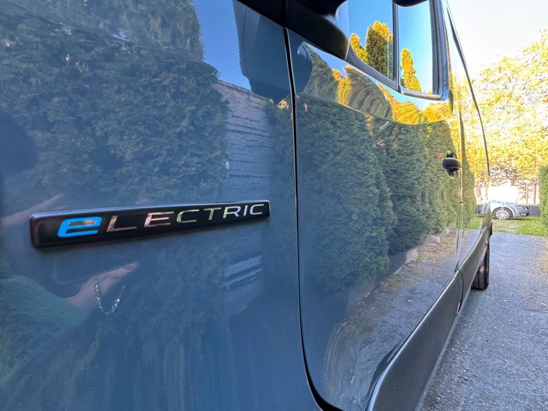 eLECTRIC badge on the electric van