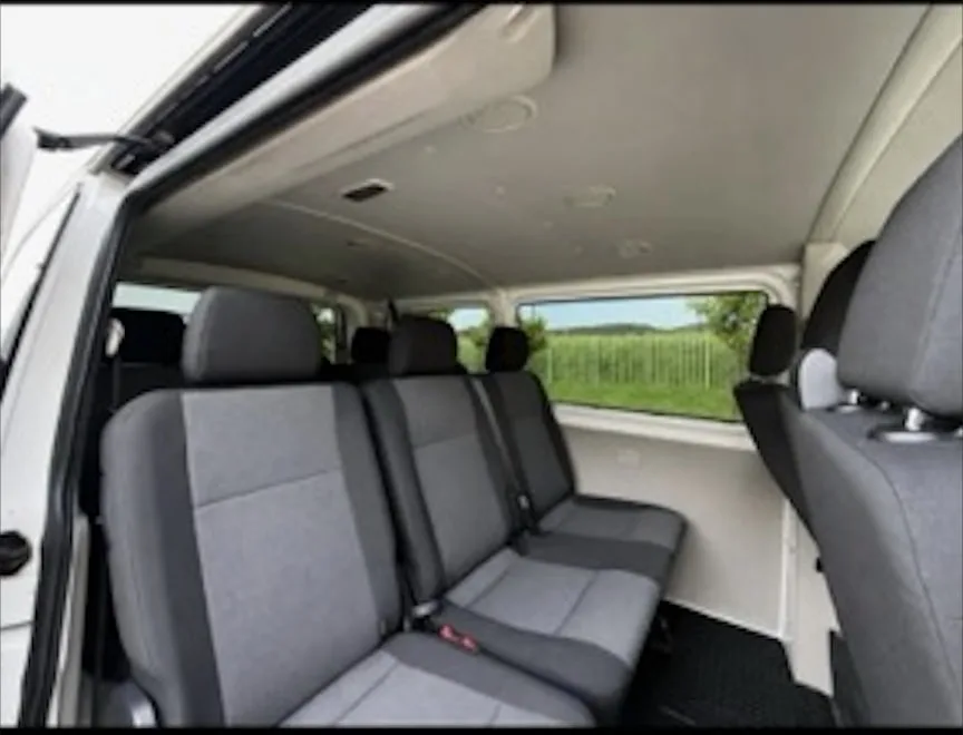 Interior of the 9-seat minibus — passenger seats